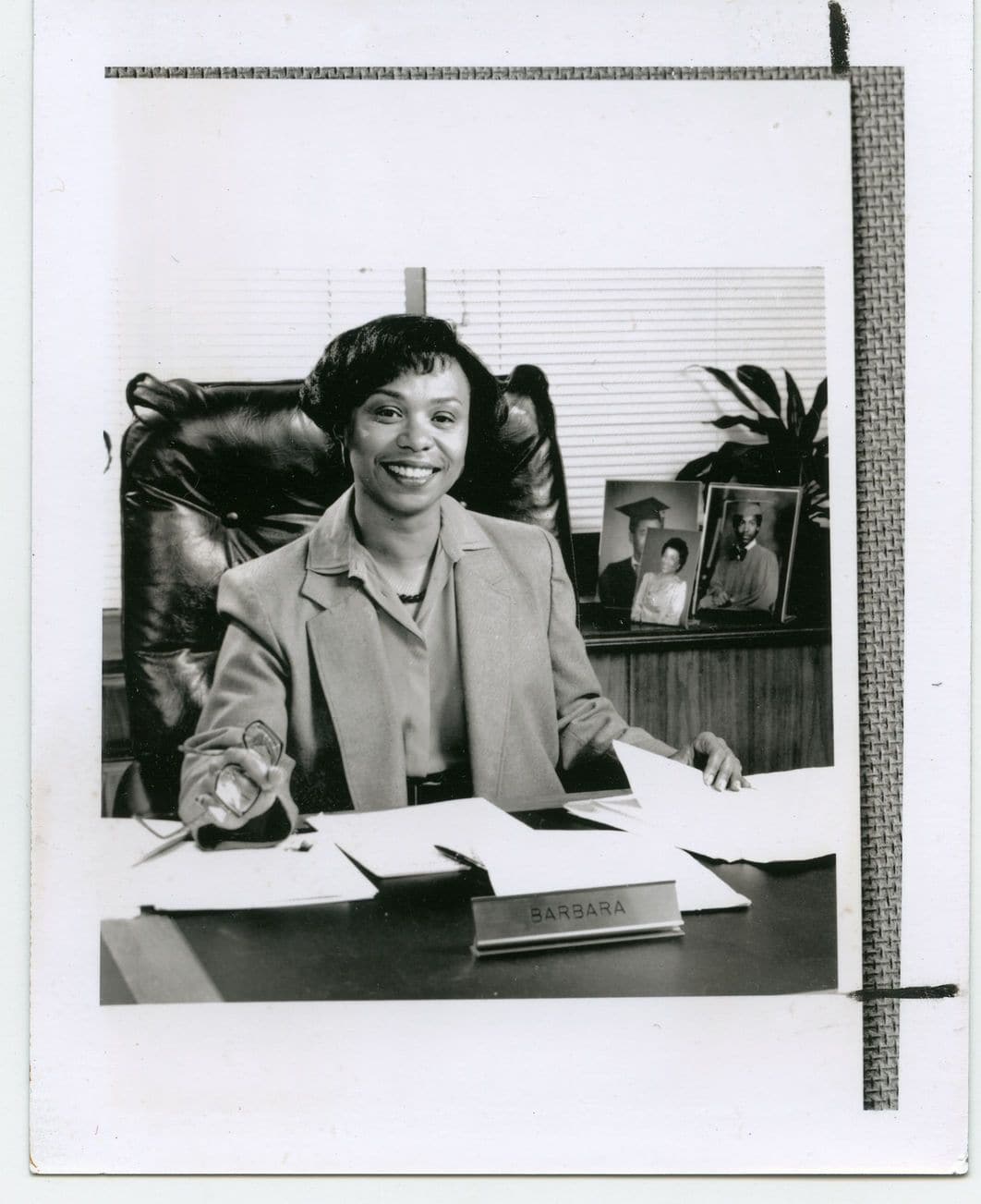 Barbara Lee sitting at her desk