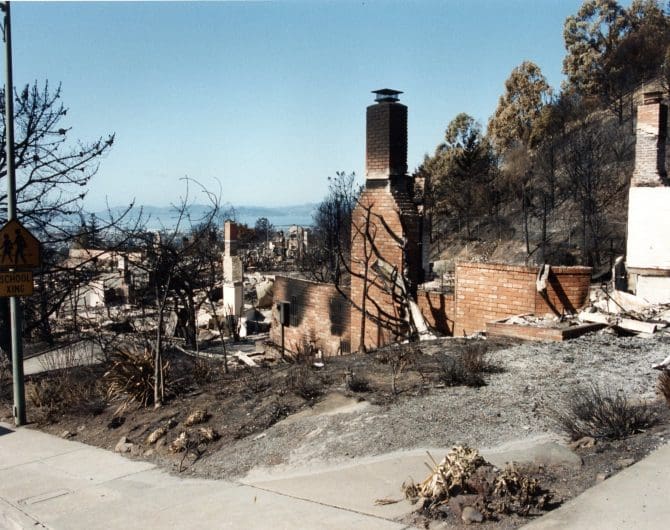 Brick foundation and chimney remains of burnt home, looking down hill after the 1991 Oakland-Berkeley hills firestorm.