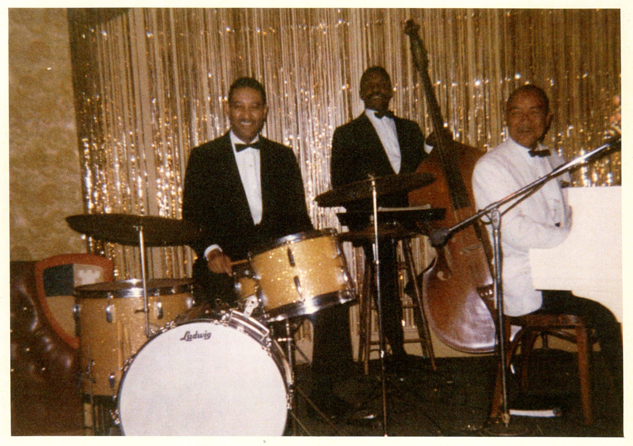 Photograph of Earl Watkins drumming with band at the Claremont Hotel Terrace Room