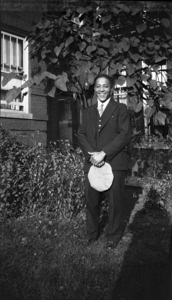 Marcus Hall in suit in backyard