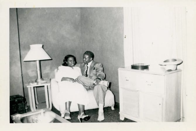 Historic image of Melzrine Moore and Warren Moore sitting on love seat in living roo