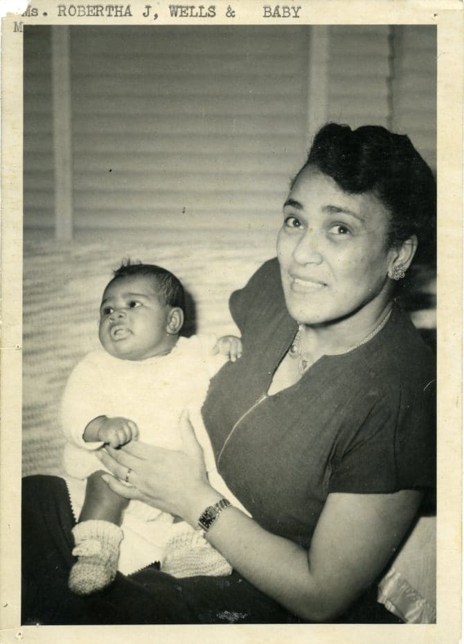 Robertha J. Wells holding baby