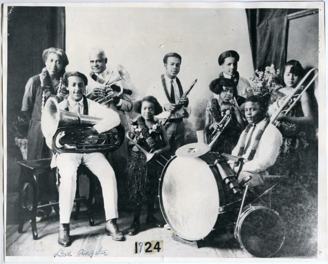 The Rousseau family band poses with their musical instruments