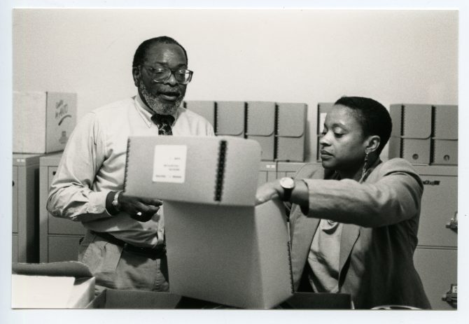 Looking at documents in the Northern California Center for African-American History & Life, circa 1990s, MS32