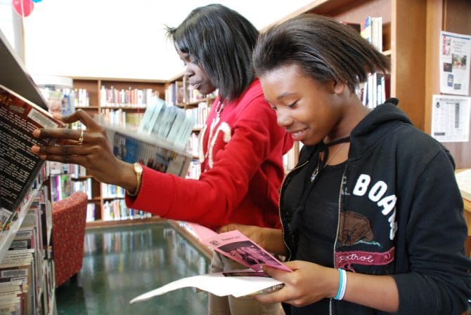 teens looking for books at elm
