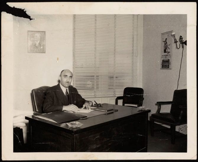 Historic image of C.L. Dellums at desk