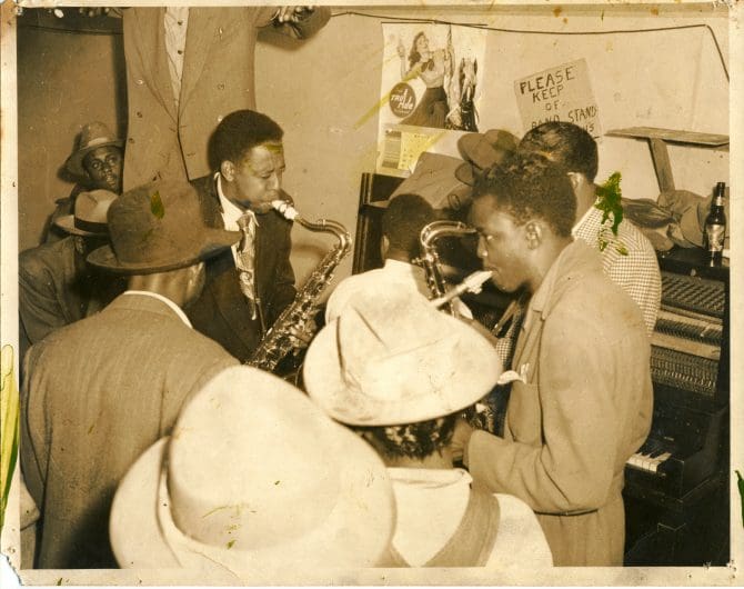 Historic image of Saxophone players performing in nightclub