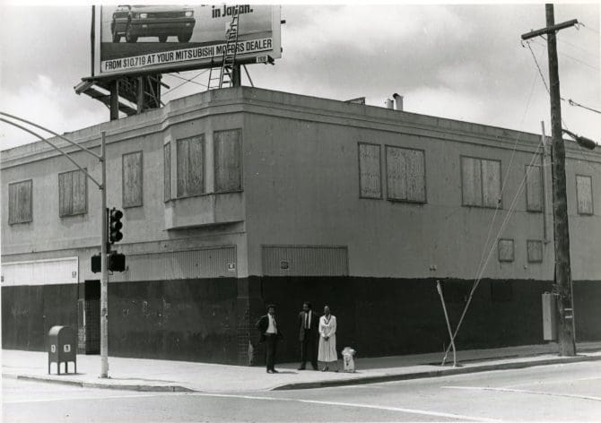 Exterior of old Black Panther Party building at 85th Ave. and E. 14th St. slated for remodeling as Project Interface [5635] circa 1980s