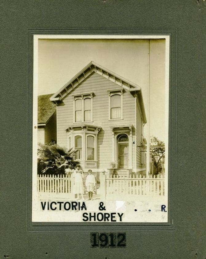 Victoria Shorey and William T. Shorey Jr. in front of home at 1782 8th St. Oakland, California