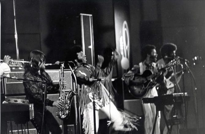 Sly and the Family Stone performing on stage