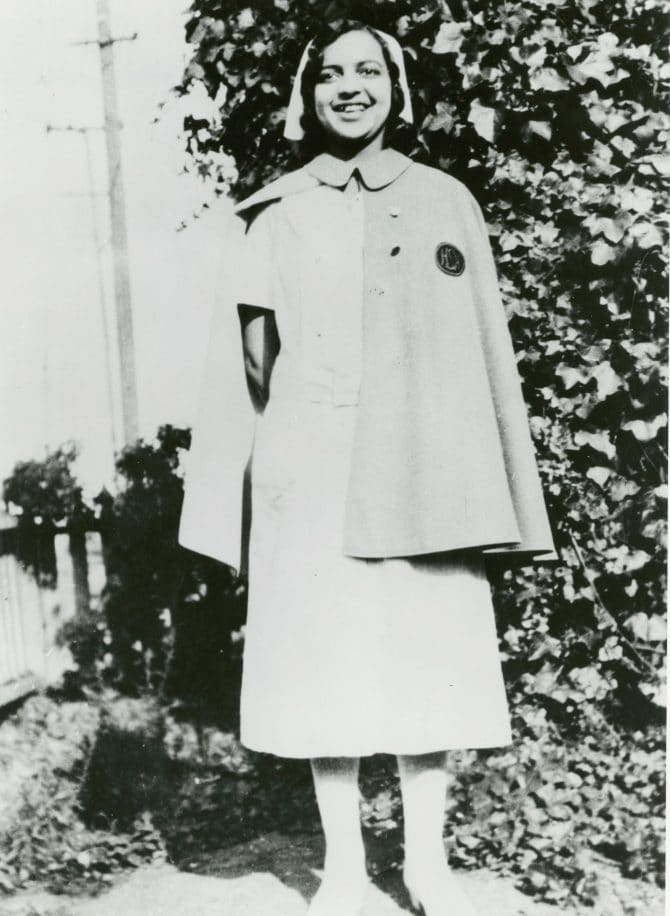 Dorothy Louise Bruce (Akers) standing in nurses uniform