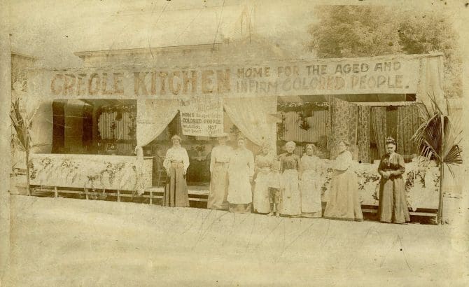 Group of women standing in front of the Home for the Aged and Infirm Colored People Creole Kitchen