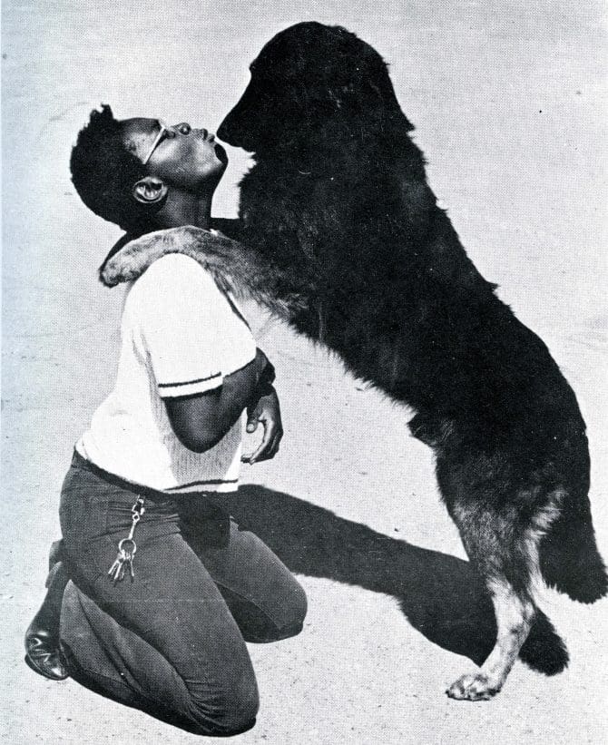 Photograph of person and dog from Pat Parker's Pit Stop