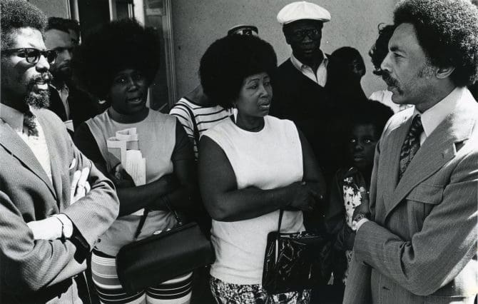 Congressman Dellums speaks with mothers of the surviving Soledad Brothers prior to entering San Quentin to investigate conditions following the death of George Jackson
