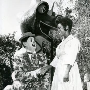Jumell Devaull shaking hands with PoPo the Clown at Children's Fairyland [ 2136 ] 1965-10-23