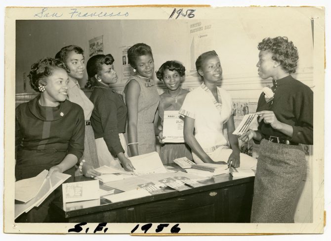 Group of women holding voting pamphlets, caption: "San Francisco 1956"