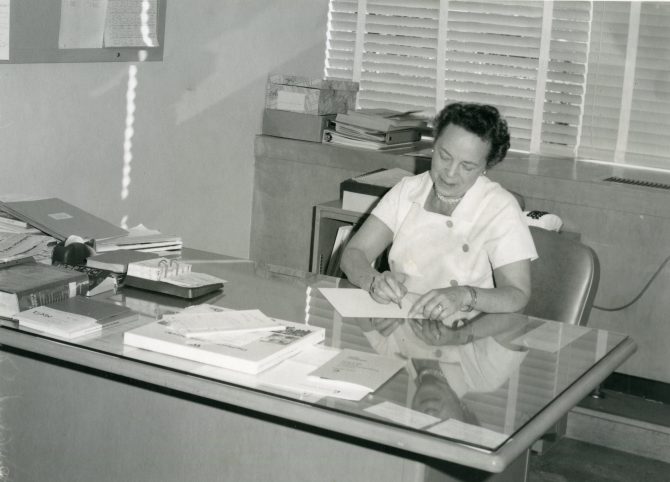 Librarian working at her desk.
