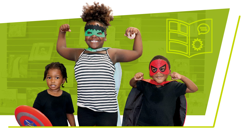 A group of three children pose like superheroes