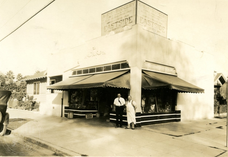 This circa 1931 photograph shows the A.E.F. Grocery at 52 East Taylor Street. I believe that the two men pictured are likely partners Paul Malvase and Rocco Aloi.
