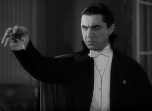 Bela Lugosi playing Count Dracula, hypnotizing a victim