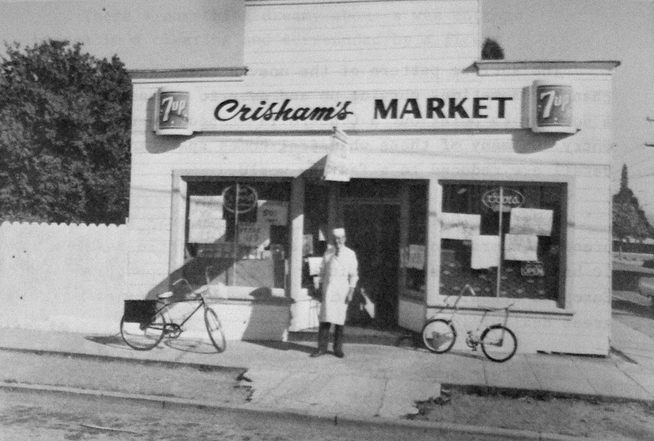 Image: Pete Crisham and his market on the corner of Coe and Broadway Avenues in the mid-1970s. Photo courtesy of Elizabeth Giarratana.