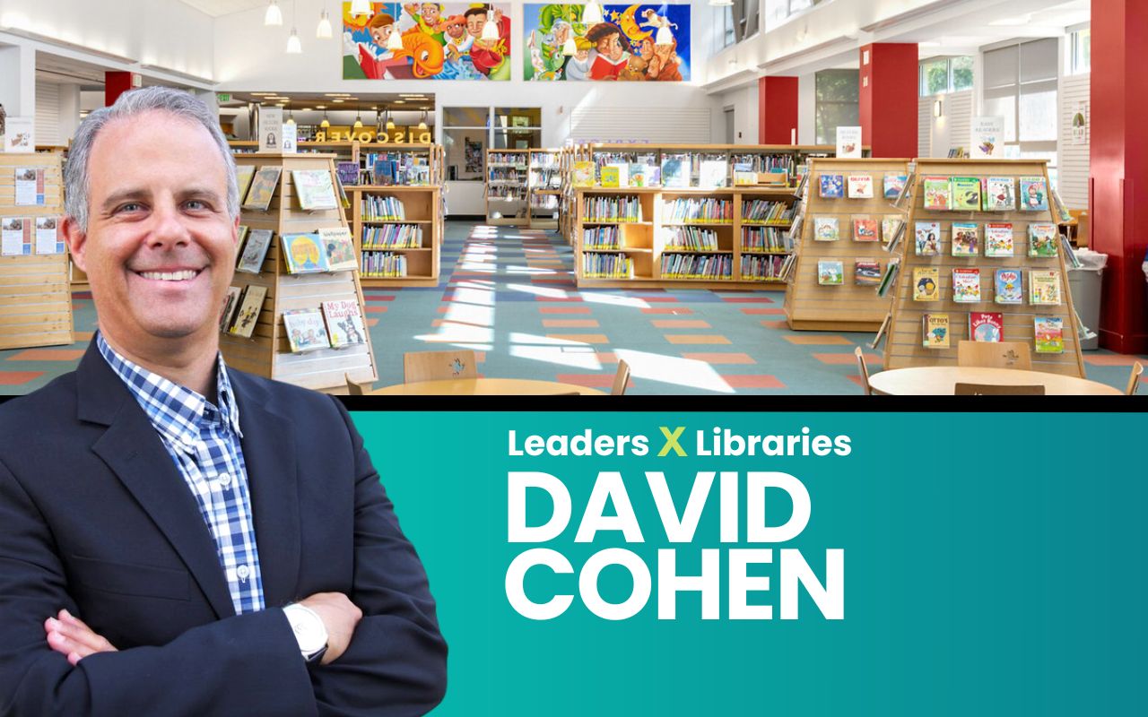 A composite of a cutout councilmember David Cohen with the Berryessa branch library's interior behind him.