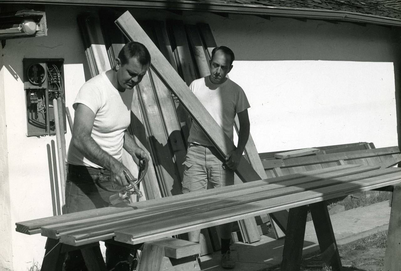 Image: Dean (left) and Glenn at work. Dean did the basic design and construction. Damian Speno later completed the work on the second story, which included converting the rear garage to additional living space. Collection of Ralph Pearce