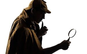 Sherlock Holmes looking through a magnifying glass