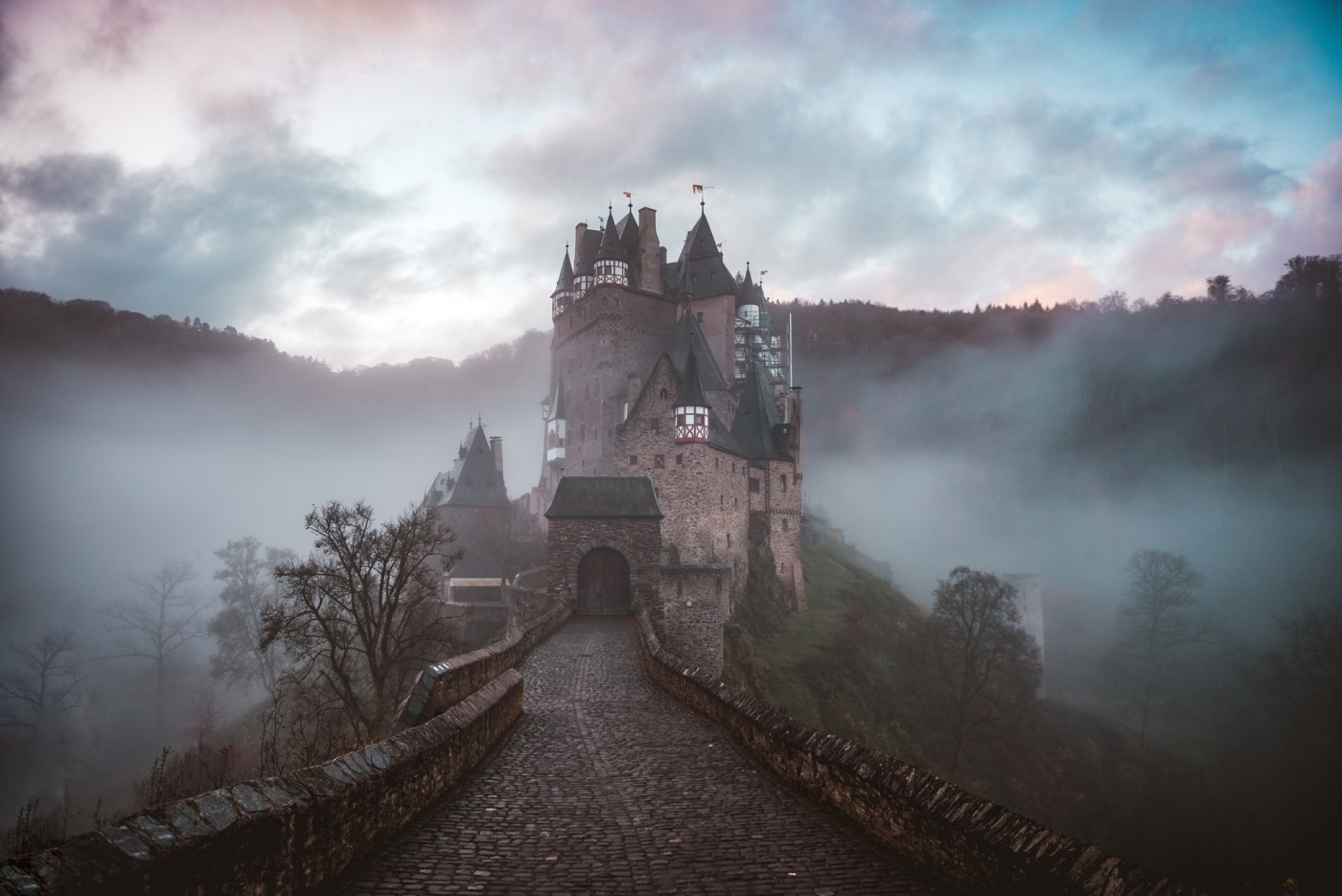A tall, lonely castle shrouded in mist. image by Cederic Vandenberghe.