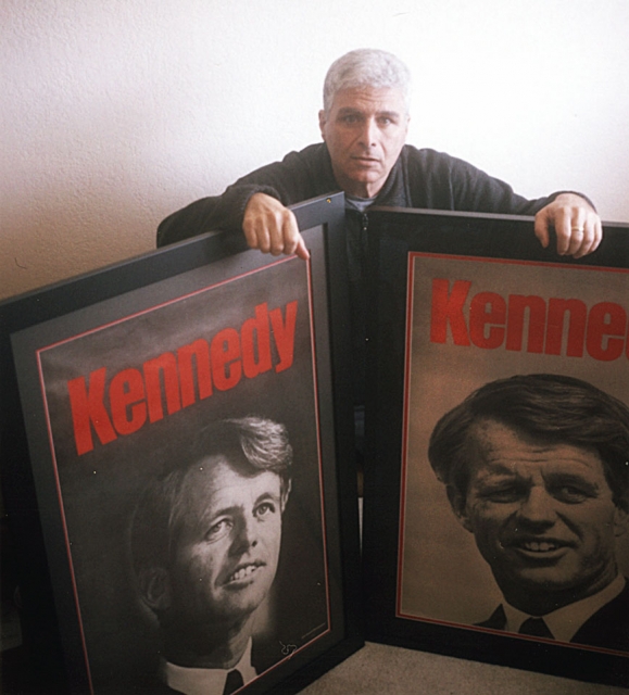 Ed Souza with posters of Robert F. Kennedy
