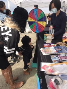 kid in front of a prize wheel