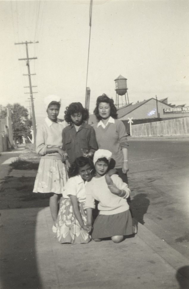 Image: Filipinas pose near Pinoytown canneries in the 1940s. Photo courtesy of the Bacosa Family.