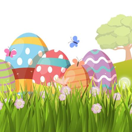 Colorfully decorated eggs in grass with flowers.