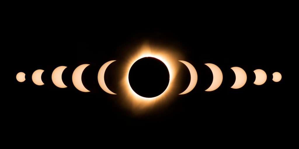 Phases of a solar eclipse on a black background.