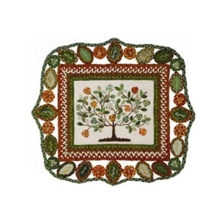Green and brown rug with leaf designs and a tree in center.