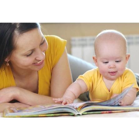 Mother and toddler reading a book.