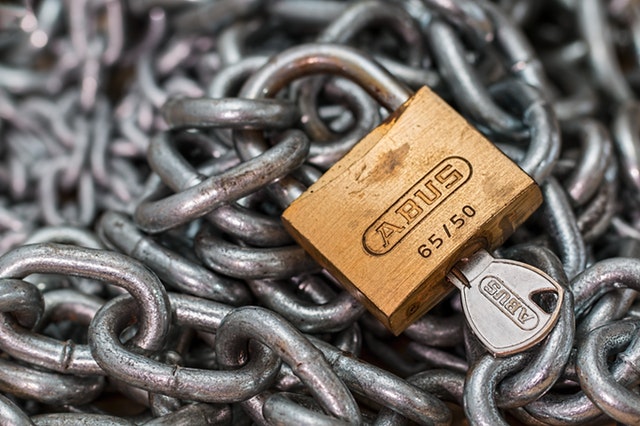 Image of a Lock, Key and Chains
