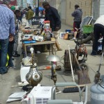 vendors selling wares, like lamps, small appliances, and other sundries.
