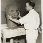 A man works on creating the clay model for a grotesque head. Source: Special Collections, Chicago Park District Records: Photographs, Image 051_009_007