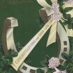 horseshoe decorated with ribbon and clover