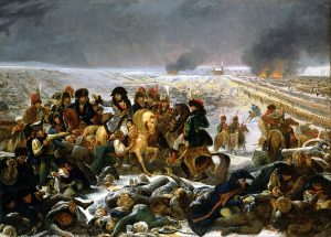 Napoleon on a white horse surrounded by his men as well as bodies on the battlefield