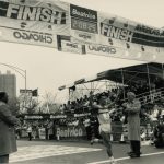 Mayor Washington holds finish for the 1986 Marathon's male winner, Toshiko Seko