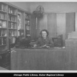 Woman sitting at desk in library