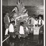 children decorate a Christmas tree