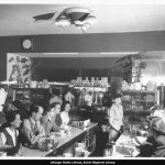 Staff and customers at diner counter