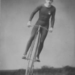Man on bicycle with large front wheel