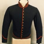 Blue jacket with red trim and gold buttons