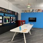 Maker space table and online resources bulletin board
