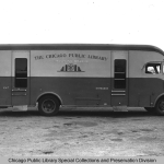 A black and white photo of a bookmobile with Chicago Public Library printed on the side.