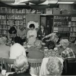 Patrons gather for a cooking demonstration at the library.